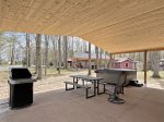 Outside covered patio with private hot tub, BBQ grill, and picnic table 